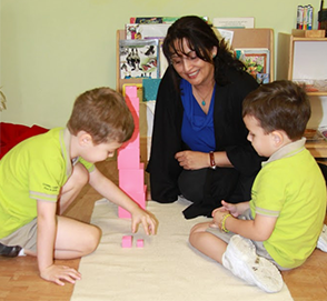 Montessori teacher with pre-schoolers